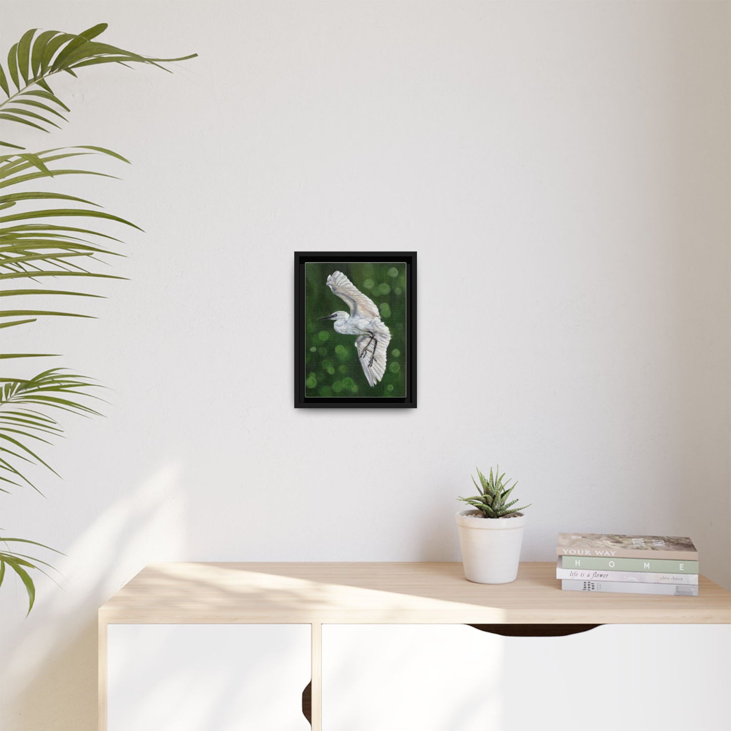 Framed Egret Canvas Art — White Egret Flying Over Green Bokeh