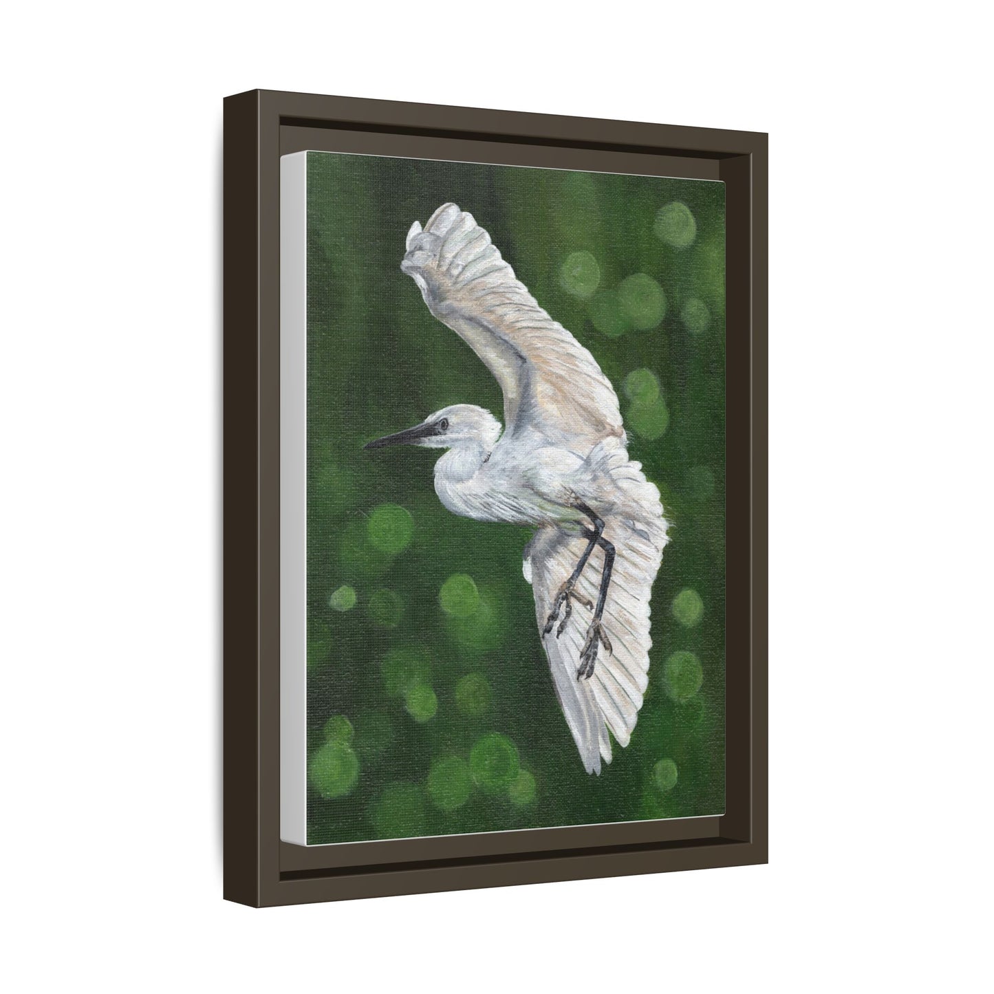 Framed Egret Canvas Art — White Egret Flying Over Green Bokeh